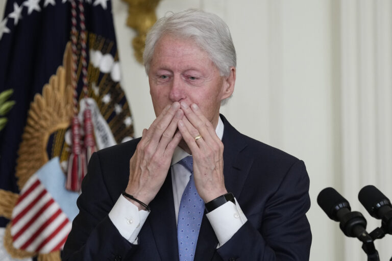 Former President Bill Clinton blows a kiss to someone in the audience as he speaks as President Joe Biden listens during an event in the East Room of the White House in Washington, Thursday, Feb. 2, 2023, to mark the 30th Anniversary of the Family and Medical Leave Act. (AP Photo/Susan Walsh)