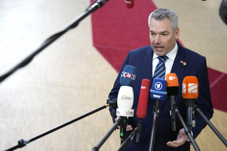 Austria's Chancellor Karl Nehammer speaks with the media as he arrives for an EU summit at the European Council building in Brussels on Thursday, Feb. 9, 2023. European Union leaders are meeting for an EU summit to discuss Ukraine and migration. (AP Photo/Virginia Mayo)
