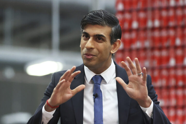 Britain's Prime Minister Rishi Sunak holds a Q&A session with local business leaders during a visit to Coca-Cola HBC in Lisburn, Northern Ireland, Tuesday Feb. 28, 2023. Sunak traveled to Belfast on Tuesday to sell his landmark agreement with the European Union to its toughest audience: Unionist politicians who fear post-Brexit trade rules are weakening Northern Ireland's place in the United Kingdom. (Liam McBurney/Pool via AP)