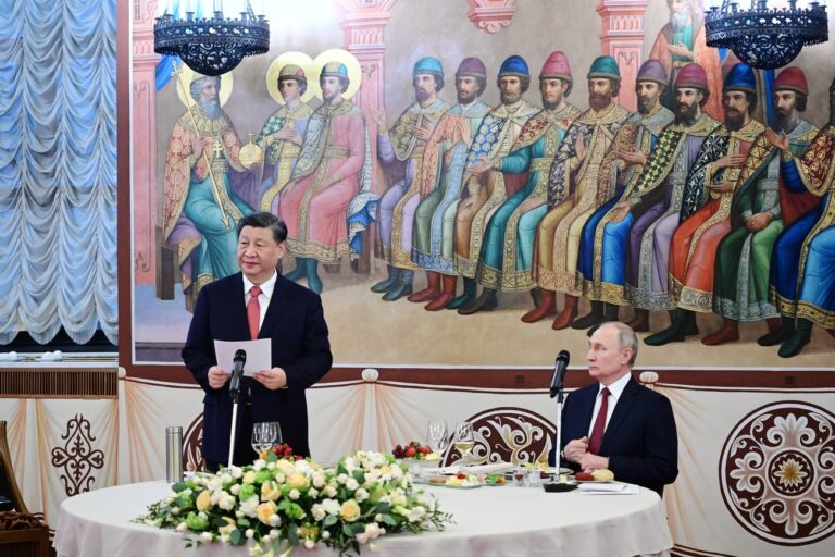Chinese President Xi Jinping, left, deliver his speech as Russian President Vladimir Putin listens to him during their dinner at The Palace of the Facets in the Moscow Kremlin, Russia, Tuesday, March 21, 2023. (Pavel Byrkin, Sputnik, Kremlin Pool Photo via AP)