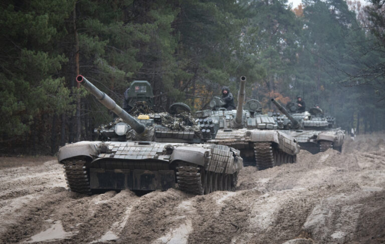 FILE - Ukrainian soldiers on captured Russian tanks T-72 hold military training close to the Ukraine-Belarus border near Chernihiv, Ukraine, Friday, Oct. 28, 2022. (AP Photo/Aleksandr Shulman, File)