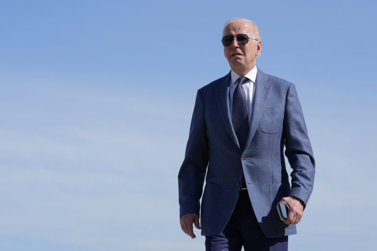 President Joe Biden walks over to speak with members of the press before boarding Air Force One, Tuesday, April 11, 2023, at Andrews Air Force Base, Md. Biden is traveling the United Kingdom and Ireland in part to help celebrate the 25th anniversary of the Good Friday Agreement. (AP Photo/Patrick Semansky)