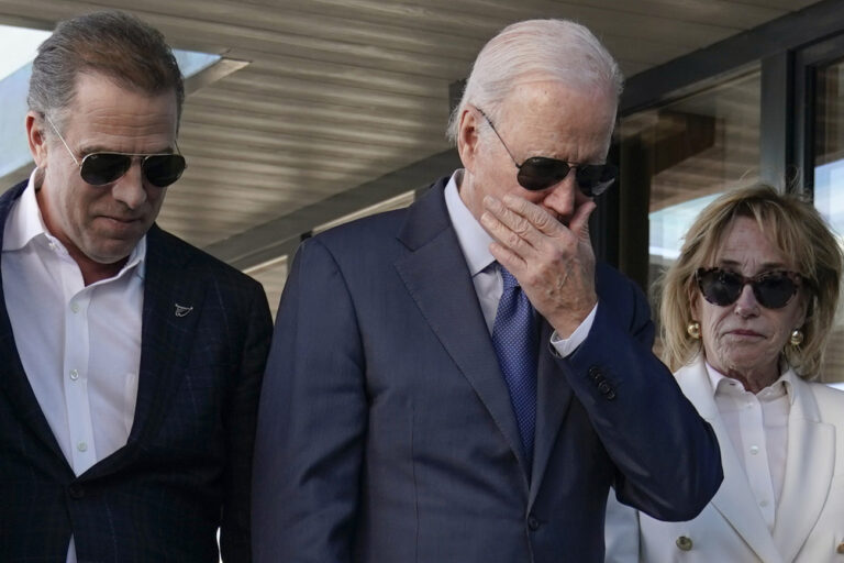 President Joe Biden stands with his son Hunter Biden, left, and sister Valerie Biden Owens, right, as he looks at a plaque dedicated to his late son Beau Biden while visiting Mayo Roscommon Hospice in County Mayo, Ireland, Friday, April 14, 2023. (AP Photo/Patrick Semansky)