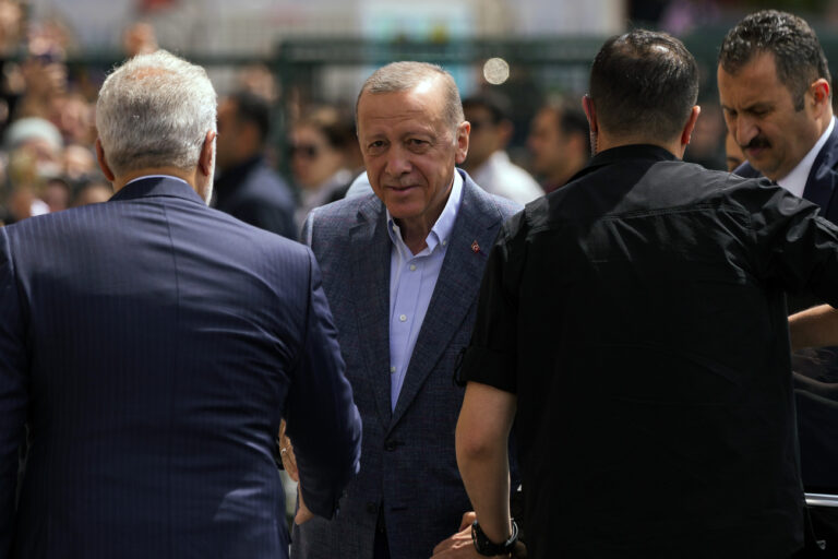 President Recep Tayyip Erdogan arrives to a polling station to vote in Istanbul, Turkey, Sunday, May 14, 2023. Turkey is voting in pivotal parliamentary and presidential elections that are expected to be tightly contested and could be the biggest challenge President Recep Tayyip Erdogan has faced in his two decades in power (AP Photo/Francisco Seco)