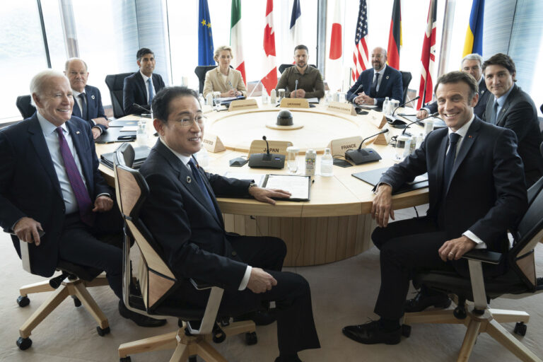 Ukrainian President Volodymyr Zelenskyy, center rear, joins G7 world leaders at a working session on the final day of the G7 Summit in Hiroshima, Japan, Sunday, May 21, 2023. From left to right are: Japan's Prime Minister Fumio Kishida, U.S. President Joe Biden, German Chancellor Olaf Scholz, Britain's Prime Minister Rishi Suna, European Commission President Ursula von der Leyen, Zelenskyy, European Council President Charles Michel, Gianluigi Benedetti, Italian ambassador to Japan, Canada's Prime Minister Justin Trudeau, and France's President Emmanuel Macron. (Stefan Rousseau/Pool via AP)