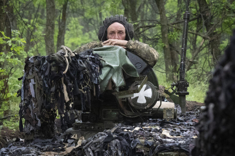 A Ukrainian tanker looks out from his position near Bakhmut, Donetsk region, Ukraine, Tuesday, May 23, 2023. (AP Photo/Efrem Lukatsky)