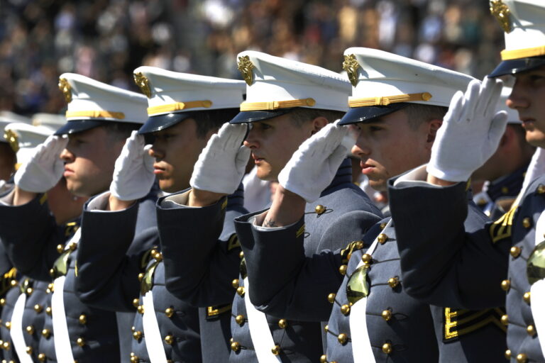 epa10657873 United States Military Academy graduating cadets salute at the beginning of the commencement ceremonies at Michie Stadium in West Point, New York, USA, 27 May 2023. EPA/PETER FOLEY