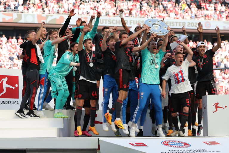 epa10658023 Bayern Munich's players celebrate with the league title trophy after winning the German Bundesliga soccer match between 1.FC Cologne and FC Bayern Munich, in Cologne, Germany, 27 May 2023. Bayern Munich won the title due to a better goal difference. EPA/ANNA SZILAGYI CONDITIONS - ATTENTION: The DFL regulations prohibit any use of photographs as image sequences and/or quasi-video.