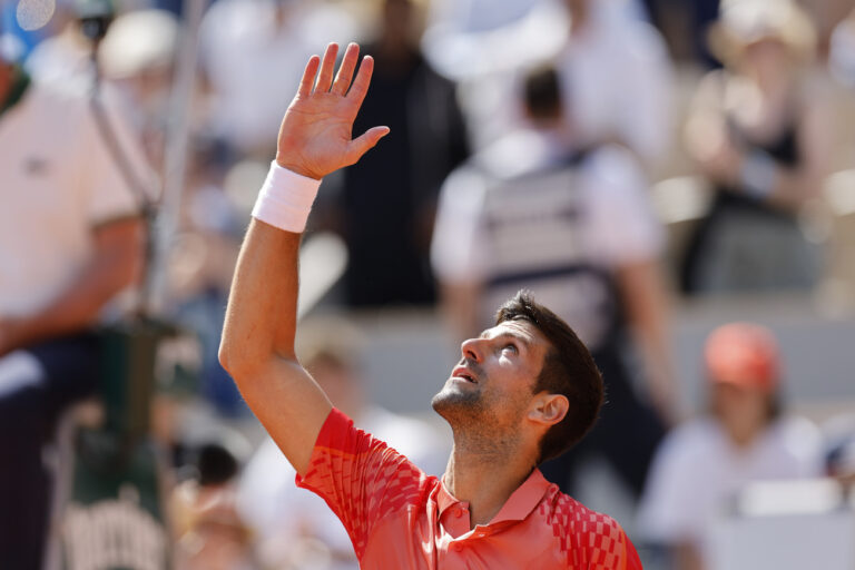Serbia's Novak Djokovic celebrates after winning the first round match of the French Open tennis tournament against Aleksandar Kovacevic of the U.S. in three sets, 6-3, 6-2, 7-6 (7), at the Roland Garros stadium in Paris, Monday, May 29, 2023. (AP Photo/Jean-Francois Badias)