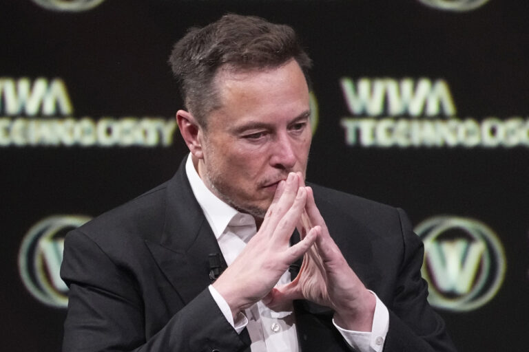 Elon Musk, who owns Twitter, Tesla and SpaceX, reacts at the Vivatech fair Friday, June 16, 2023 in Paris. Vivatech is Europe's biggest startup and tech event. (AP Photo/Michel Euler)