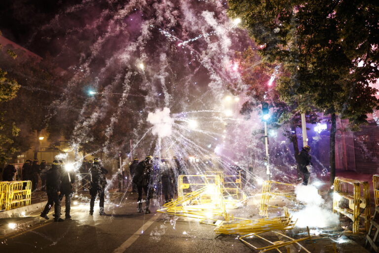 epa10716122 Protesters throw fireworks at riot police during clashes in Nanterre, near Paris, France, 29 June 2023. Violence broke out after police fatally shot a 17-year-old during a traffic stop in Nanterre on 27 June 2023. According to the French interior minister, 31 people were arrested with 2,000 officers being deployed to prevent further violence. EPA/YOAN VALAT