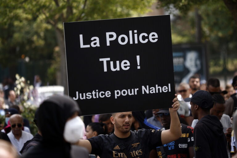 epa10717293 People attend a march in memory of 17-year-old Nahel who was killed by French Police in Nanterre, near Paris, France, 29 June 2023. Violence broke out after the police fatally shot a 17-year-old during a traffic stop in Nanterre on 27 June 2023. According to the French interior minister, 31 people were arrested with 2,000 officers being deployed to prevent further violence. The banner reads 