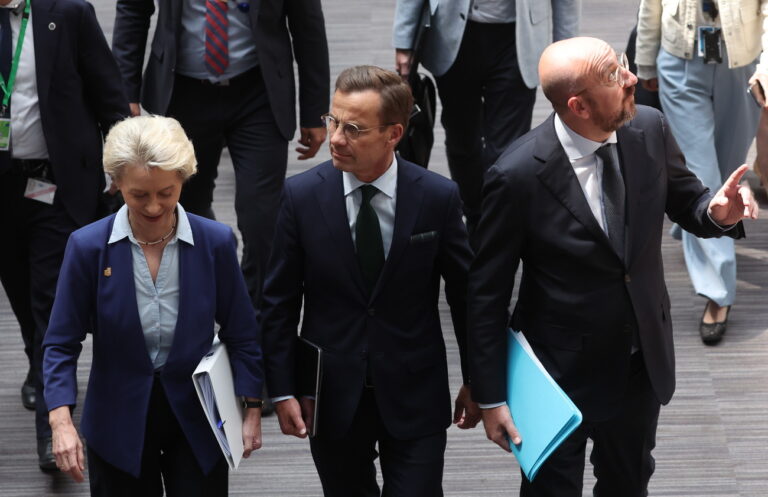 epa10719301 (L-R) European Commission President Ursula von der Leyen, Sweden's Prime Minister Ulf Kristersson and European Council President Charles Michel on their way for the last press conference, on the second day of a European Council in Brussels, Belgium, 30 June 2023. EU leaders are gathering in Brussels for a two-day summit to discuss the latest developments in relation to Russia's invasion of Ukraine and continued EU support for Ukraine as well as the block's economy, security, migration and external relations, among other topics. EPA/OLIVIER HOSLET