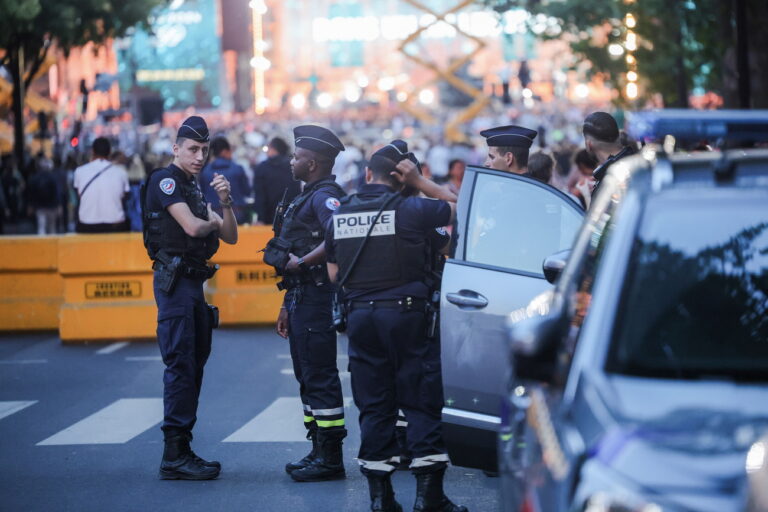epa10724940 Police officers stand near the venue of the 'One Year to Go Paris 2024' (Dans un An Les Jeux Paris 2024) concert, held amid massive police presence following days of violent protests, in Paris, France, 03 July 2023. Violence broke out across France over the fatal shooting of a 17-year-old teenager by a police officer during a traffic stop in Nanterre on 27 June. EPA/OLIVIER MATTHYS