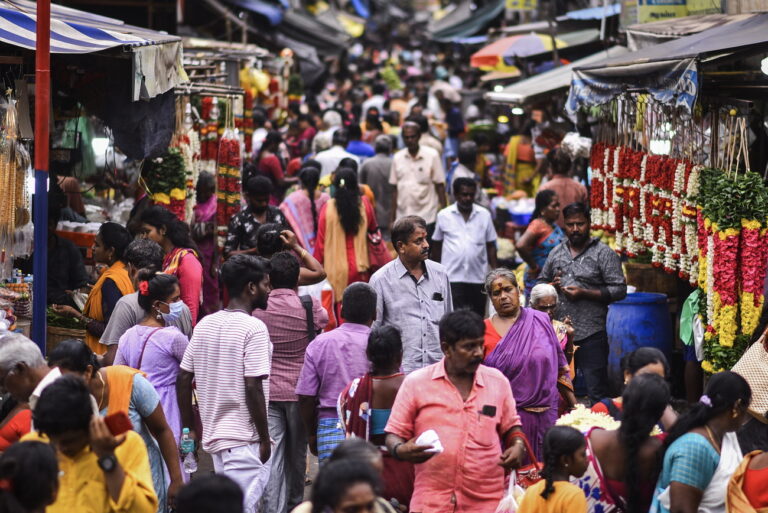 epa10739845 People shop at a crowded flower market on World Population Day, at Broadway, in Chennai, India, 11 July 2023. World Population Day, established by the United Nations (UN), is observed every year on 11 July to raise awareness and educate individuals about global overpopulation issues and their impact on various aspects of human life. According to the United Nations (UN) population estimates, India has surpassed China to become the world's most populous country with more than 1.4 billion population in April 2023. The theme for World Population Day 2023 is 'Unleashing the power of gender equality: Uplifting the voices of women and girls to unlock our world's infinite possibilities'. EPA/IDREES MOHAMMED