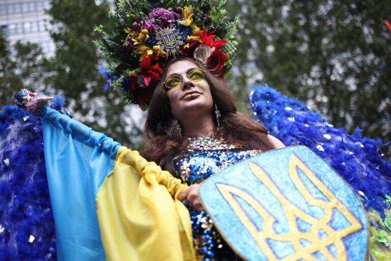 epa10761628 Drag queen 'Marlen Scandal' holds a Ukrainian flag as she takes part in the 'CSD Berlin 2023' Christopher Street Day parade in Berlin, Germany, 22 July 2023. The 45th Christopher Street Day in Berlin will be opened by Berlin governing mayor Kai Wegner and German 'Bundestag' parliament president Baerbel Bas. CSD is an annual European LGBTIQA* (lesbian, gay, bisexual, transgender, intersex, queer/questioning, asexual) community celebration held in various cities across Europe for the rights of LGBTIQA* people. EPA/CLEMENS BILAN