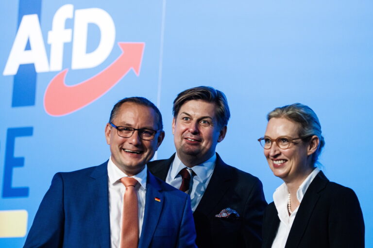 epa10774071 Alternative for Germany party (AfD) board member Maximilian Krah (C), co-chairman Tino Chrupalla (L) and co-chairwoman Alice Weidel (R) stand next to each other during the AfD party convention in Magdeburg, Germany, 28 July 2023. The Alternative for Germany (AfD) holds their 14th federal party congress in Magdeburg on 28 July 2023, followed by a five day European Elections assembly. EPA/CLEMENS BILAN