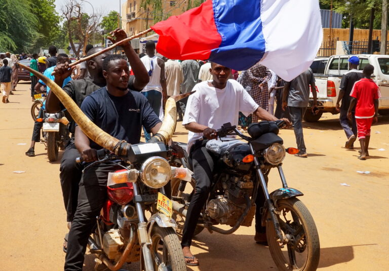 epa10777414 Protesters on motorbikes carry a Russian flag during a protest in Niamey, Niger, 30 July 2023. Thousands of supporters of General Abdourahamane Tchiani, head of the Presidential Guard, who declared himself the new leader of Niger after a coup against democratically elected President Mohamed Bazoum on 26 July, took to the streets of Niamey to demonstrate support for the coup. EPA/ISSIFOU DJIBO