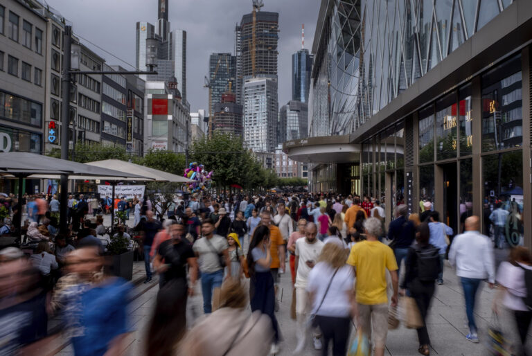 People walk in the main shopping street 'Zeil' in central Frankfurt, Germany, Saturday, Aug. 5, 2023. (AP Photo/Michael Probst)