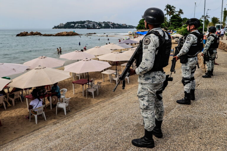 epa10795163 Members of the National Guard (GN) guard beaches at the beach resort of Acapulco, Guerrero state, Mexico, on 10 August 2023 (Issued 11 August 2023). A wave of violence is once again hitting Acapulco, one of Mexico's most iconic beaches, where blockades and attacks by criminal groups have left more than 7,500 hotel room cancellations this holiday season, according to businessmen in the sector. EPA/David Guzmà¡n