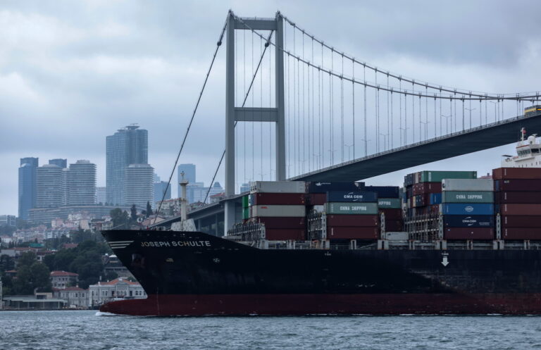 epa10805158 The Hong Kong-flagged Joseph Schulte, the first cargo ship to leave Ukraine's Odesa port since the end of the grain deal despite Russian threats, sails under the 15 July Martyrs Bridge on the Bosphorus in Istanbul, Turkey, 18 August 2023. EPA/ERDEM SAHIN