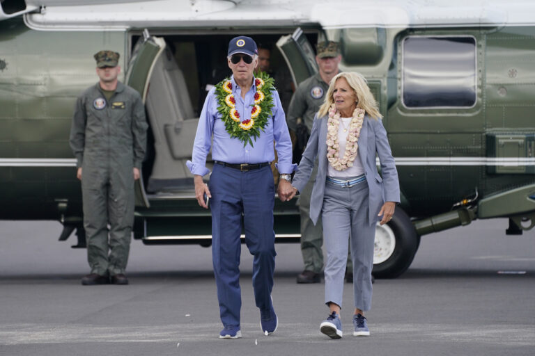President Joe Biden and first lady Jill Biden walk to board Air Force One after visiting the site of the devastating Maui wildfires and the ongoing recovery efforts, Monday, Aug. 21, 2023, in Kahului, Hawaii. (AP Photo/Evan Vucci)