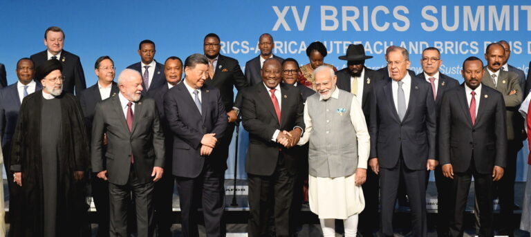 epa10819144 A handout photo made available by the Government Information Service shows the South African President Cyril Ramaphosa, (C) shaking hands with the Prime Minister of India Narendra Modi (3-R) while posing for a family photo with other BRICS leaders and delegates during the closing day of the BRICS Summit at the Sandton Convention Center, Johannesburg, South Africa, 24 August 2023 (issued 25 August 2023). The BRICS leaders announced that they would welcome six new members in January 2024: Iran, Argentina, Egypt, Ethiopia, Saudi Arabia and the United Arab Emirates. EPA/KOPAN O TIAPE / HANDOUT HANDOUT EDITORIAL USE ONLY/NO SALES