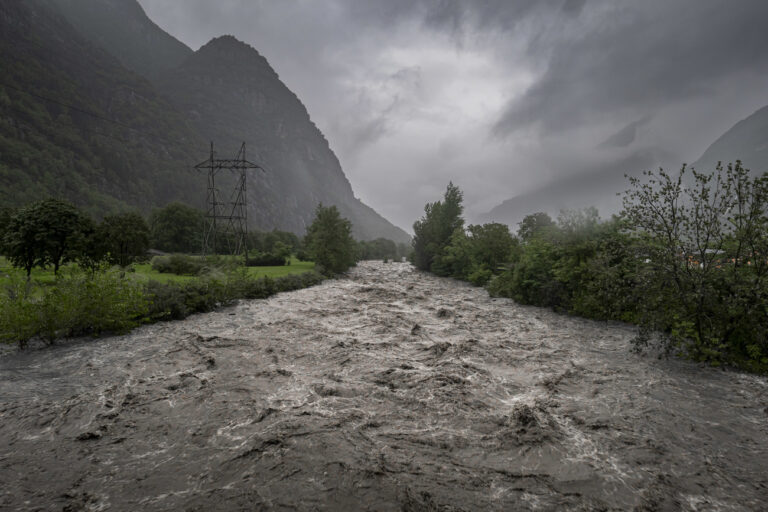 The Brenno river carries a lot of water after heavy rainfalls in southern Switzerland in Biasca, Switzerland, Sunday, August 27, 2023. The canton Tessin, the Italian part of Switzerland, got a lot of rain since Friday night. According to forecasts, the rains will continue until Monday. (KEYSTONE/Ti-Press/Pablo Gianinazzi)