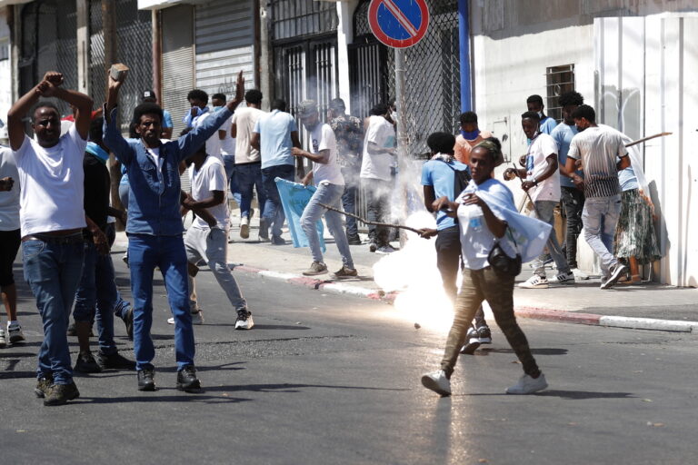 epa10835692 Opponents of the Eritrean regime react during a protest against a pro-regime conference followed by clashes with Israeli police, in Tel Aviv, Israel, 02 September 2023. The protest was held against a pro-Eritrean regime conference due to be held at the Eritrean embassy in Israel on 02 September. The conference is part of many others organized by Eritrean embassies worldwide, often sparking violent reactions. According to Israeli medical sources, some 35 protesters and 12 policemen were injured in the clashes. EPA/ATEF SAFADI