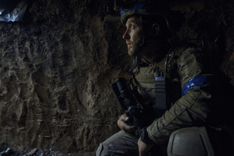 A soldier of Ukraine's 3rd Separate Assault Brigade looks on in a trench under the shelling near Bakhmut, the site of fierce battles with the Russian forces in the Donetsk region, Ukraine, Monday, Sept. 4, 2023. (AP Photo/Libkos)