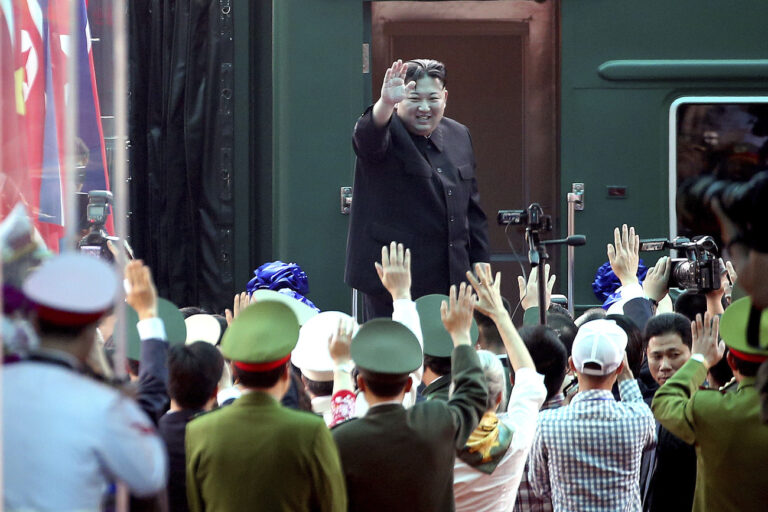 FILE- North Korean leader Kim Jong Un waves at the Dong Dang railway station in Dong Dang, Vietnam, on March 2, 2019. North Korean leader Kim Jong Un's possible trip to Russia might be like his first one in 2019, a rattling, 20-hour ride aboard a green-and-yellow armored train that is a quirky symbol of his family's dynastic leadership. (AP Photo/Minh Hoang, File)