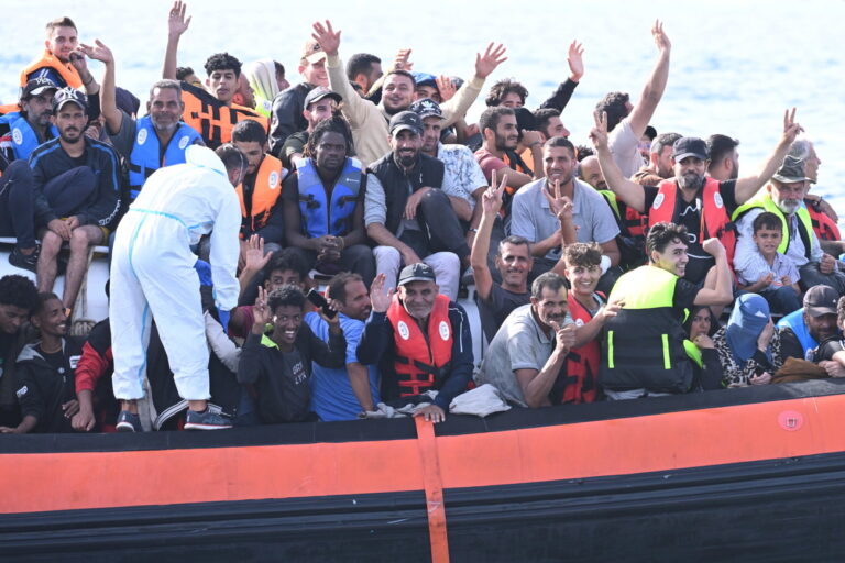 epa10868024 Migrants crowd the deck of the Italian Coast Guard patrol boat CP327 as it arrives in the port of Lampedusa, 18 September 2023. More than 1,000 migrants remain in the hotspots of Lampedusa where they await transfer. Italian Deputy Premier and Foreign Minister Antonio Tajani on 15 September called for the intervention of the United Nations in response to the significant increase in the arrival of migrants and refugees by sea to Italy in recent days. EPA/CIRO FUSCO