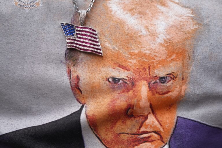 epa10891073 A person wears an American flag necklace over a Trump t-shirt outside the California GOP convention where former US President Donald Trump is scheduled to deliver a speech in Anaheim, California, USA, 29 September 2023. EPA/ALLISON DINNER