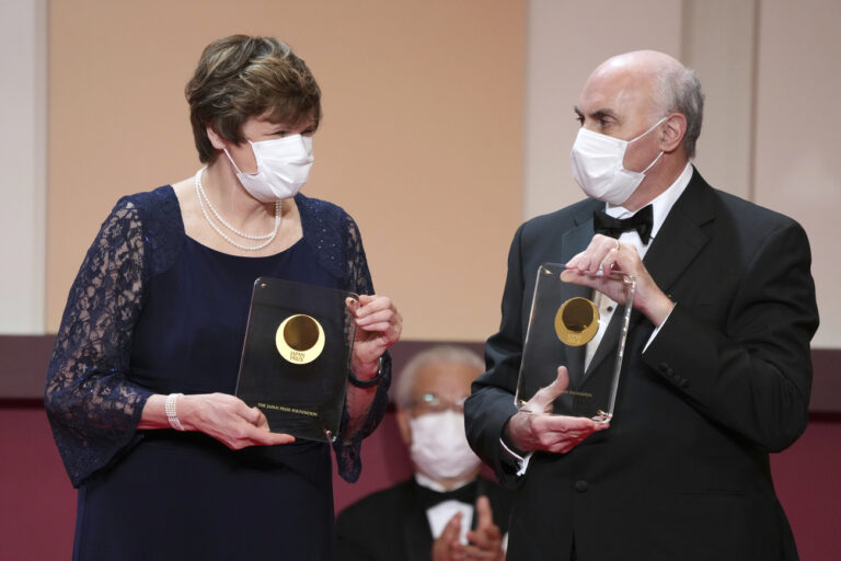 FILE - Japan Prize 2022 laureates Hungarian-American biochemist Katalin Kariko, left, and American physician-scientist Drew Weissman, right, pose with their trophies during the Japan Prize presentation ceremony Wednesday, April 13, 2022, in Tokyo. The Nobel Prize in medicine awarded to Katalin Karikó and Drew Weissman for enabling development of mRNA COVID-19 vaccines, it was announced on Monday, Oct. 2, 203. (AP Photo/Eugene Hoshiko, Pool, File)