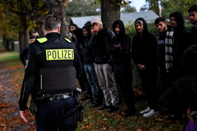 epa10913430 Migrants stand in line after being detained by German police during an operation to prevent illegal migration along the German-Polish border near Frost, Germany, 11 October 2023. Due to the increasing number of refugees arriving in Germany via the Balkan and Mediterranean routes, as well as war refugees from Ukraine, many refugee shelters in Germany have already reached their capacity limit. EPA/Filip Singer ATTENTION: This Image is part of a PHOTO SET