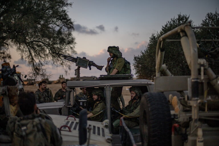 epa10913815 Israeli soldiers stand on a road near Be'eri, Israel, 11 October 2023. According to Israeli officials, 108 Israeli bodies were found in the Be'eri kibbutz, near the Gaza border, following Hamas attack on 07 october. More than 1,200 Israelis have been killed and over 2,800 others injured, according to the Israel Defense Forces (IDF), after the Islamist movement Hamas launched an attack against Israel from the Gaza Strip on 07 October. More than 3,000 people, including 1,500 militants from Hamas, have been killed and thousands injured in both Gaza and Israel since the conflict erupted, according to Israeli military sources and Palestinian officials. EPA/MARTIN DIVISEK