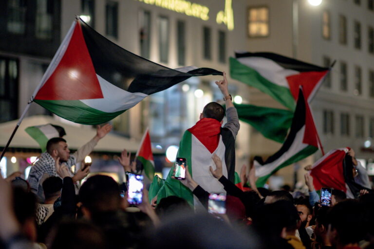 epa10913873 People wave Palestinian flags as they gather at the Saint Stephens square in a show of support for the Palestinian people in Vienna, Austria, 11 October 2023. Several hundred people participated in the vigil that had been prohibited by Austrian Police earlier in the day. Thousands of Israelis and Palestinians have died since the militant group Hamas launched an unprecedented attack on Israel from the Gaza Strip on 07 October 2023, leading to Israeli retaliation strikes on the Palestinian enclave. EPA/CHRISTIAN BRUNA