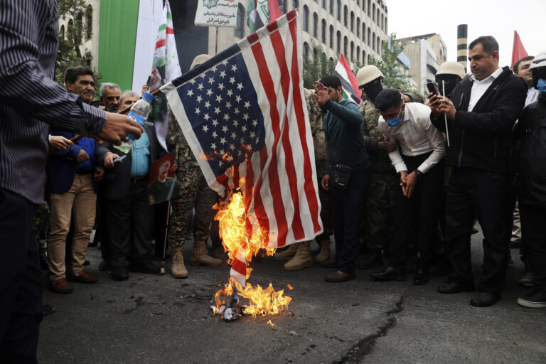 Iranian worshippers burn a U.S. flag during their pro-Palestinian rally before the Friday payers in Tehran, Iran, Friday, Oct. 13, 2023. (AP Photo)