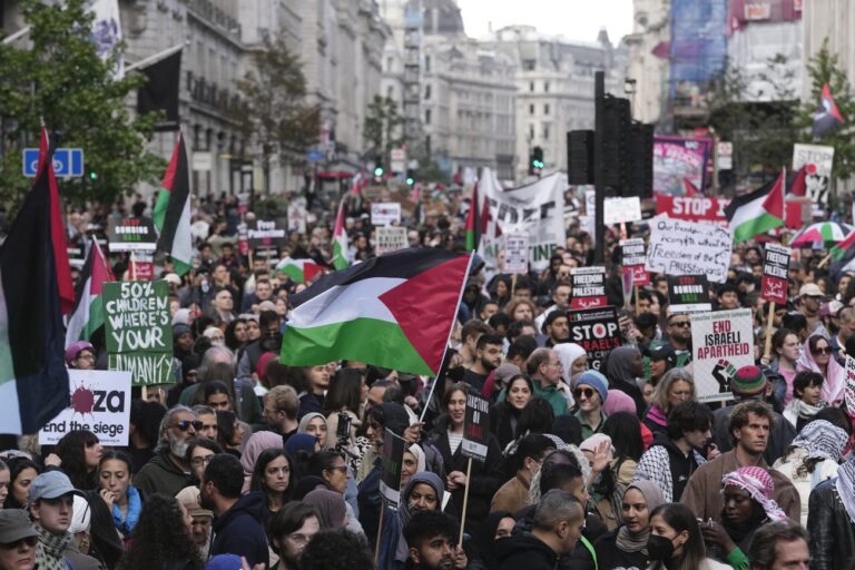 Protesters march during a pro Palestinian demonstration in London, Saturday, Oct. 14, 2023. Palestine Solidarity Campaign hosts march in support of Palestinians caught up in the war between Israel and Hamas. (AP Photo/Kin Cheung)