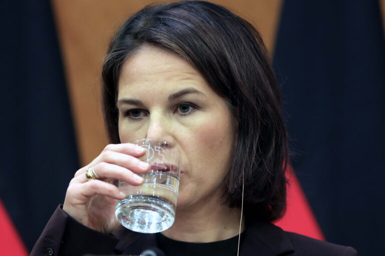 epa10927744 Foreign Minister Annalena Baerbock drinks from a glass during a joint press conference with her Jordanian counterpart, Foreign Affairs Minister Ayman Safadi (unseen), after their meeting in Amman, Jordan, 19 October 2023. Following her solidarity visit after the Hamas terror attacks to Israel and Egypt on 13 and 14 October, Baerbock visits the Middle East again on 19 and 20 October 2023 for talks with colleagues from Jordan, Israel and Lebanon, the German Foreign office announced in a press release. EPA/MOHAMMAD ALI