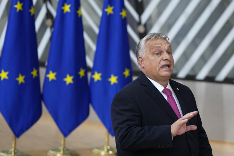 Hungary's Prime Minister Viktor Orban speaks with the media as he arrives for an EU summit at the European Council building in Brussels, Thursday, Oct. 26, 2023. European Union leaders gather Thursday for a two day meeting to discuss, among other issues, Ukraine and the impact of the war between Israel and Hamas. (AP Photo/Virginia Mayo)