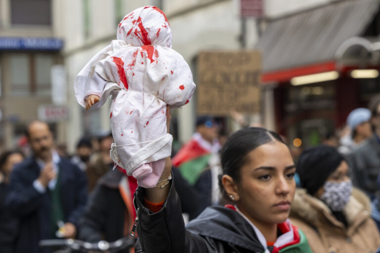 People take part in a demonstration of people-to-people solidarity against the criminalization of struggles and as well as for Palestine, in Geneva, Switzerland, Saturday, October 28, 2023. With the support of sixteen associations to denounce the criminal complicity of Western governments, in particular with the State of Israel, but also with the States of Chile, Turkey, Sudan and El Salvador. (KEYSTONE/Martial Trezzini)