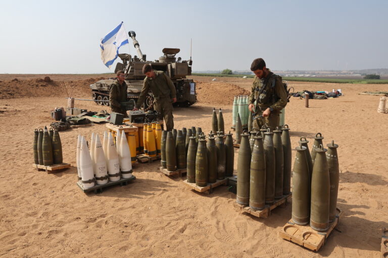 epa10954391 Israeli soldiers of an artillery unit preparing ammunition near the Gaza border, southern Israel , 02 November 2023. More than 8,000 Palestinians and over 1,400 Israelis have been killed, 240 held hostages in Gaza according to the Israel Defense Forces (IDF) and the Palestinian health authority, since Hamas militants launched an attack against Israel from the Gaza Strip on 07 October. EPA/ABIR SULTAN