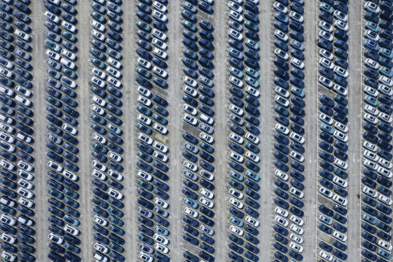 An aerial view of new passenger cars are seen at a logistics center of Changan Auto in southwestern China's Chongqing Municipality on Oct. 15, 2023. Sales of passenger cars rose 10.2% in October over a year earlier, an industry association said Wednesday, Nov. 8, as makers ramped up promotions and customers opted for electric and hybrid vehicles. (Chinatopix Via AP)
