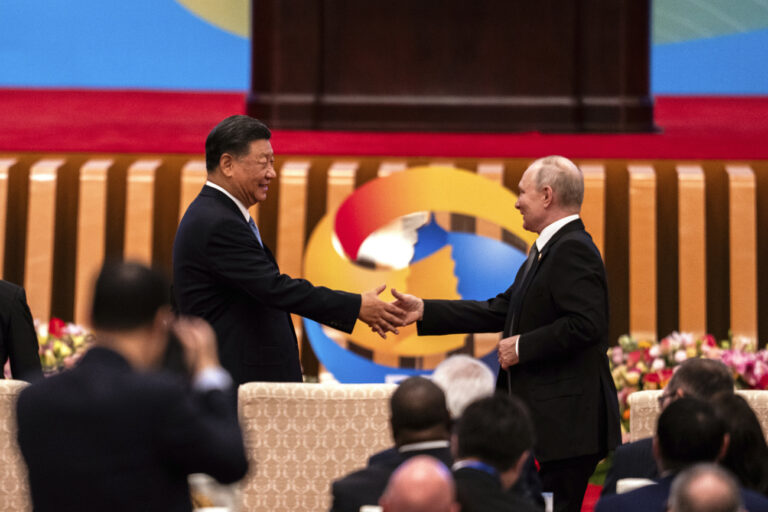 FILE - Chinese President Xi Jinping, left, and Russian President Vladimir Putin shake hands during the Belt and Road Forum at the Great Hall of the People in Beijing on Oct. 18, 2023. (AP Photo/Louise Delmotte, File)