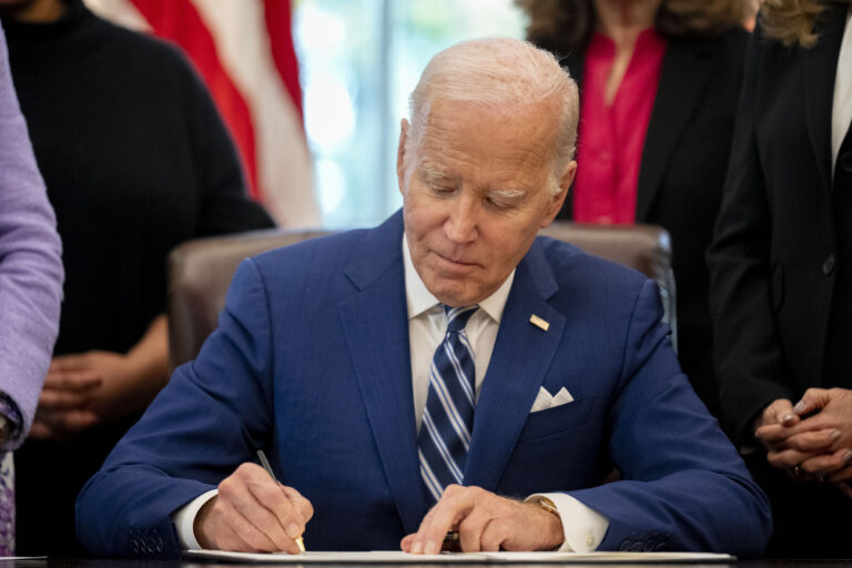FILE - President Joe Biden signs a presidential memorandum in the Oval Office of the White House, Nov. 13, 2023, in Washington. Biden has announced five nominees to federal judgeships, including the first Muslim-American on any circuit court. The Democratic president is looking to add to more than 150 of his judicial selections that have already been confirmed to the bench. (AP Photo/Andrew Harnik, File)