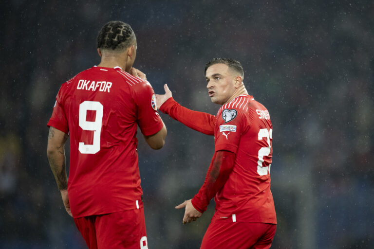 Switzerland's Xherdan Shaqiri, right, speaks with Noah Okafor during the UEFA Euro 2024 qualifying group I soccer match between Switzerlandat and Kosovo at the St. Jakob-Park stadium in Basel, Switzerland, on Saturday, November 18, 2023. (KEYSTONE/Ennio Leanza)