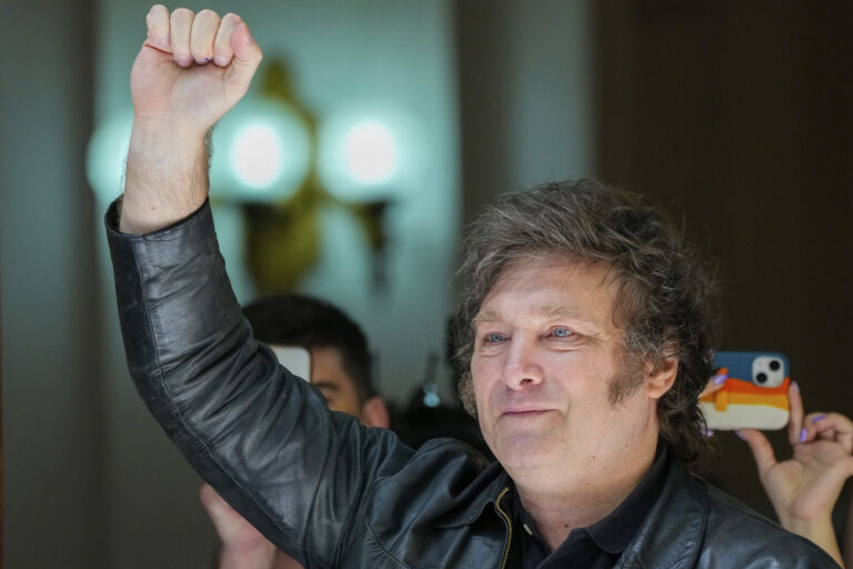 Presidential candidate of the Liberty Advances coalition Javier Milei raises his fist after voting in the presidential runoff election in Buenos Aires, Argentina, Sunday, Nov. 19, 2023. (AP Photo/Natacha Pisarenko)