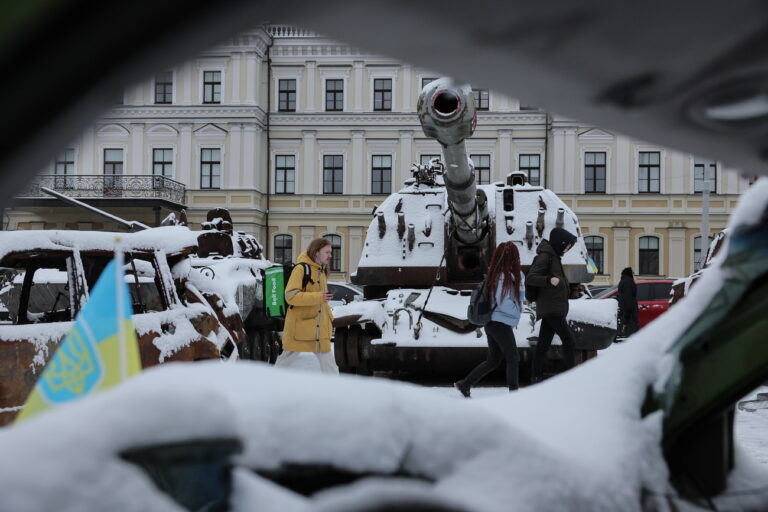 epa10989550 People walk beside destroyed Russian armored vehicles during the first snowfall of winter in Kyiv, Ukraine, 22 November 2023. Russian troops entered Ukrainian territory in February 2022, starting a conflict that has provoked destruction and a humanitarian crisis. EPA/Oleg Petrasyuk
