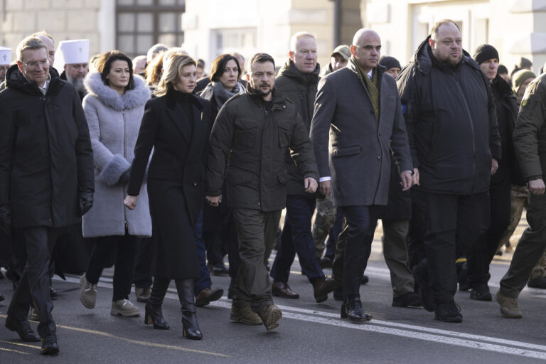 Ukrainian President Volodymyr Zelenskyy and his wife Olena Zelenska, walk next to Alain Berset, President of the Swiss Confederation, second-right, Ruslan Stefanchuk, Speaker of Ukrainian parliament, right, and Edgars Rinkevics, President of Latvia, left, during the commemoration ceremony of the Holodomor's victims (1932-1933) in Ukraine, in Kyiv, Ukraine, Saturday, Nov. 25, 2023. (Anthony Anex/Keystone via AP)